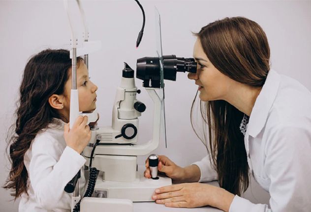 Optometrist examining a young patient using an eye examination machine, emphasizing pediatric eye care and vision health.